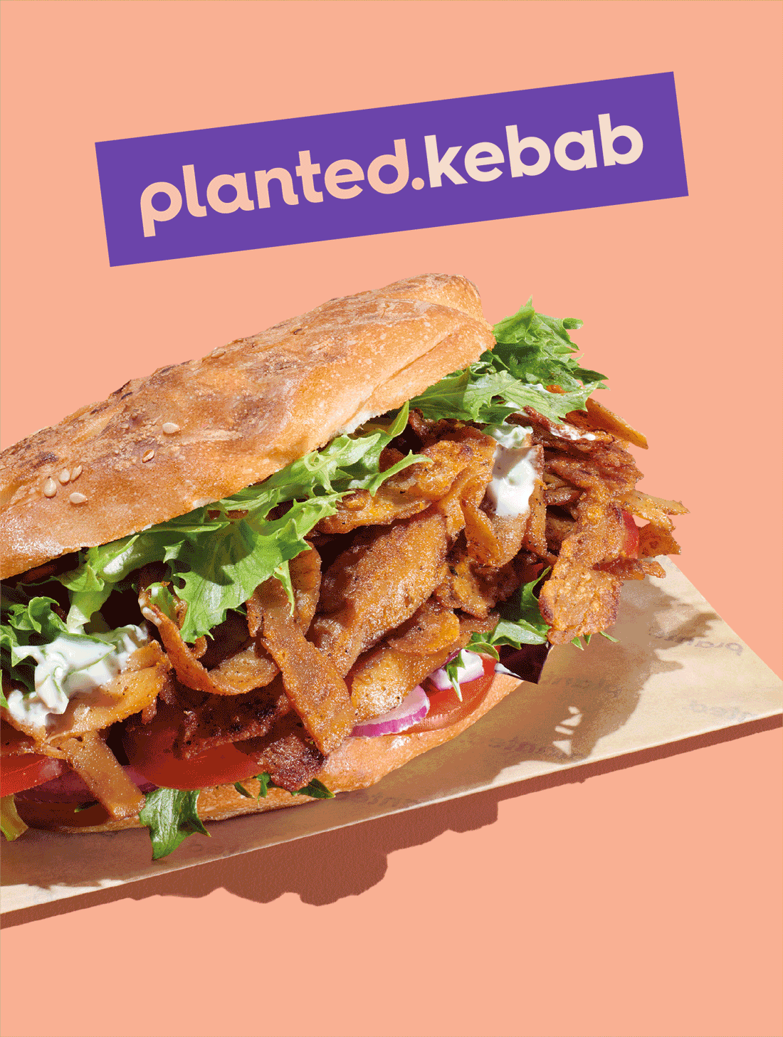 Animated poster alternating between a planted.kebab in flatbread on peach and a planted.kebab wrap on lilac